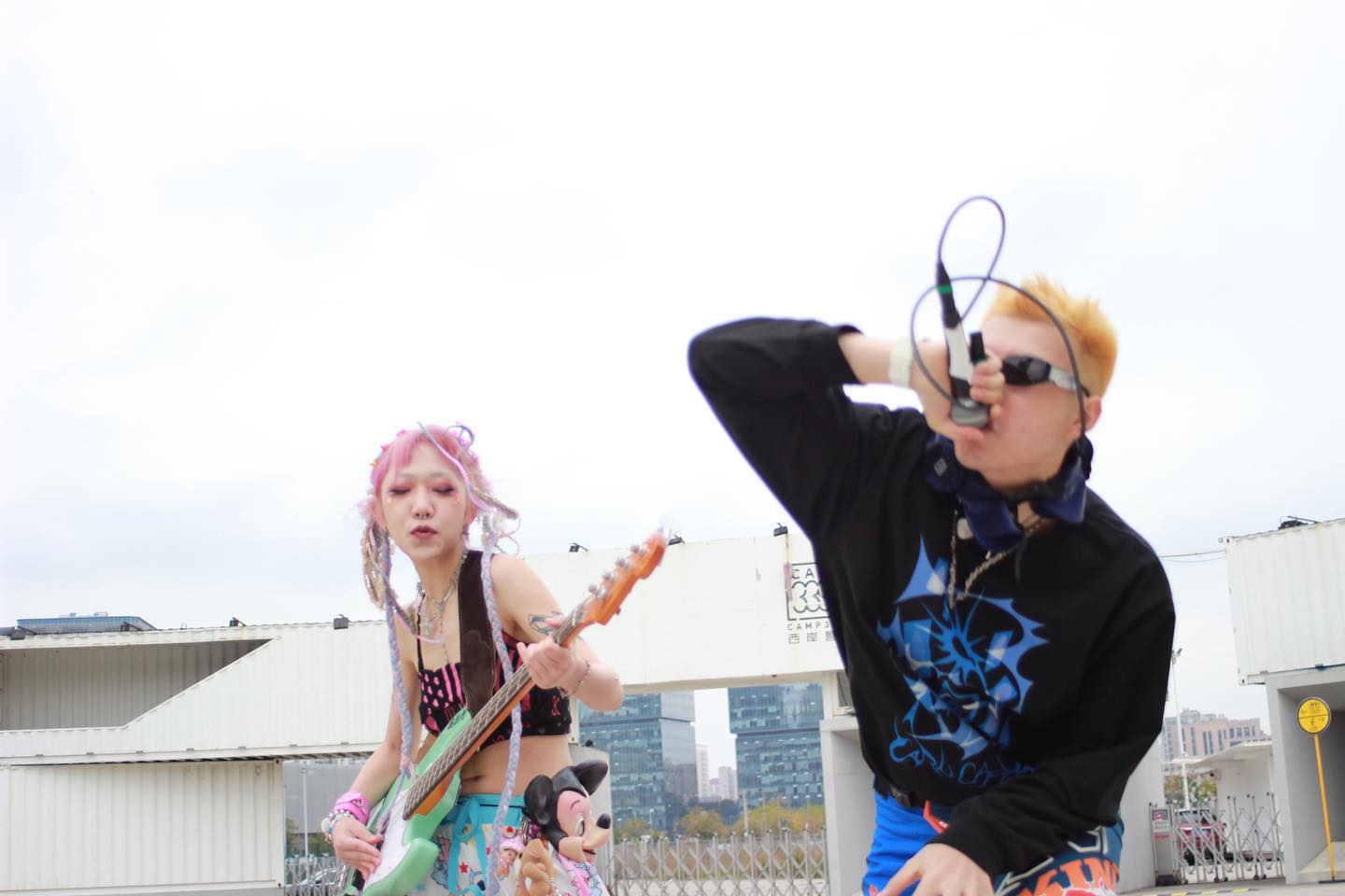 two people performing in brightly coloured clothing